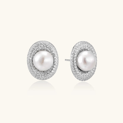 Sterling silver stud earrings with freshwater pearls surrounded by sparkling pavé crystals on white background.