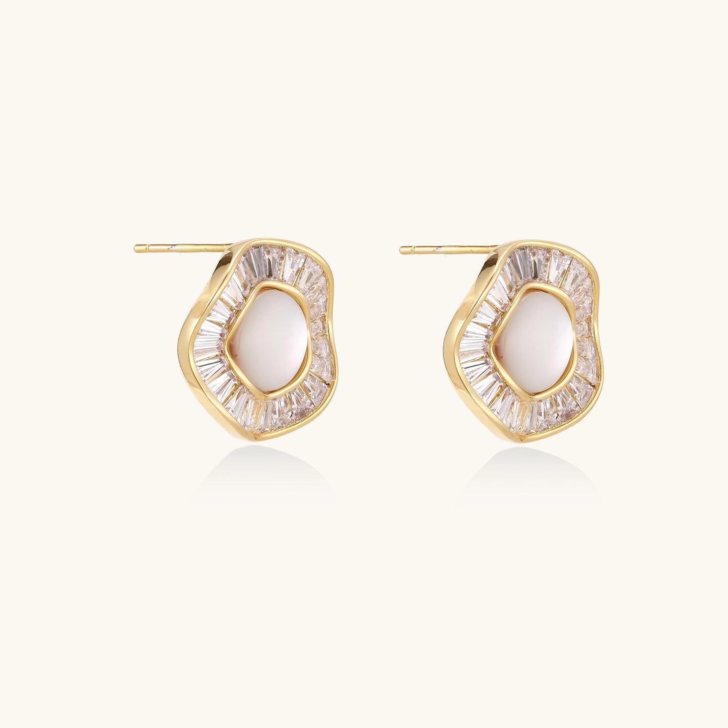 Gold-plated stud earrings with central freshwater pearl surrounded by baguette crystals in radial pattern