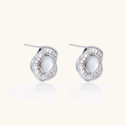 Gold-plated stud earrings with central freshwater pearl surrounded by baguette crystals in radial pattern