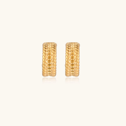 Close-up of 14K gold plated textured hoop earrings with rope pattern against cream background showing convertible design